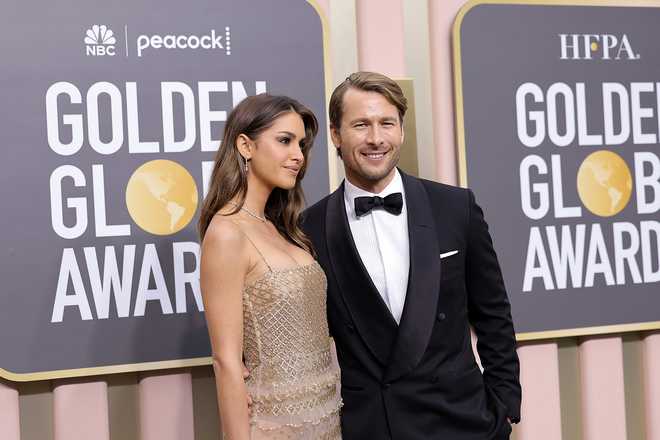 BEVERLY&#x20;HILLS,&#x20;CALIFORNIA&#x20;-&#x20;JANUARY&#x20;10&#x3A;&#x20;&#x28;L-R&#x29;&#x20;Gigi&#x20;Paris&#x20;and&#x20;Glen&#x20;Powell&#x20;attend&#x20;the&#x20;80th&#x20;Annual&#x20;Golden&#x20;Globe&#x20;Awards&#x20;at&#x20;The&#x20;Beverly&#x20;Hilton&#x20;on&#x20;January&#x20;10,&#x20;2023&#x20;in&#x20;Beverly&#x20;Hills,&#x20;California.&#x20;&#x28;Photo&#x20;by&#x20;Amy&#x20;Sussman&#x2F;Getty&#x20;Images&#x29;