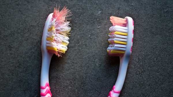 used and new toothbrushes