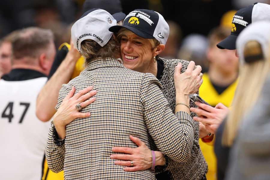 SEATTLE, WASHINGTON - MARCH 26: Head coach Lisa Bluder associate head coach Jan Jensen of the Iowa Hawkeyes celebrate after defeating the Louisville Cardinals 97-83 in the Elite Eight round of the NCAA Women&apos;s Basketball Tournament at Climate Pledge Arena on March 26, 2023 in Seattle, Washington. (Photo by Steph Chambers/Getty Images)