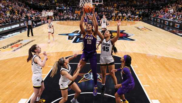 DALLAS, TEXAS - APRIL 02: Angel Reese #10 of the LSU Lady Tigers battles against Hannah Stuelke #45 of the Iowa Hawkeyes during the third quarter during the 2023 NCAA Women's Basketball Tournament championship game at American Airlines Center on April 02, 2023 in Dallas, Texas. (Photo by Maddie Meyer/Getty Images)