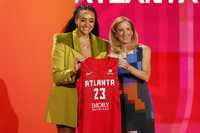 NEW YORK, NEW YORK - APRIL 10: WNBA Commissioner Cathy Engelbert and Haley Jones pose for photos after Jones was drafted 6th overall by the Atlanta Dream during the 2023 WNBA Draft at Spring Studios on April 10, 2023 in New York City. NOTE TO USER: User expressly acknowledges and agrees that, by downloading and or using this photograph, User is consenting to the terms and conditions of the Getty Images License Agreement. (Photo by Sarah Stier/Getty Images)