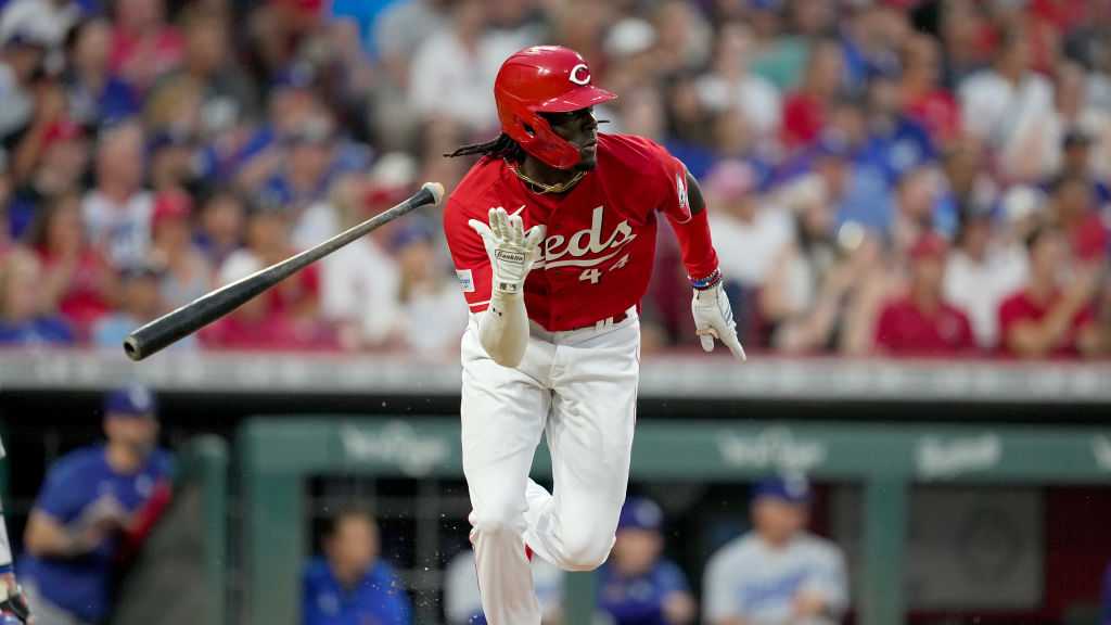 Elly de La Cruz Cincinnati Reds Unsigned Running with Mr. Redlegs Photograph