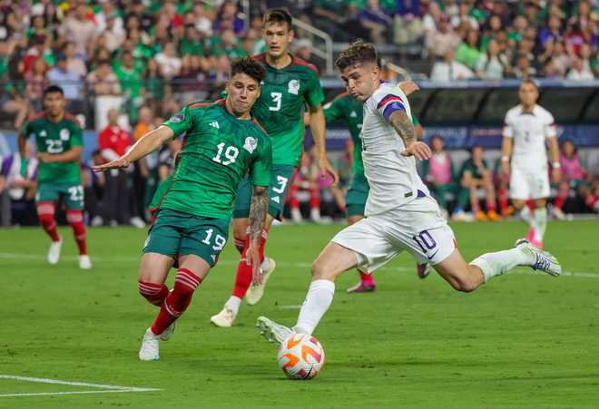 LAS&#x20;VEGAS,&#x20;NEVADA&#x20;-&#x20;JUNE&#x20;15&#x3A;&#x20;Christian&#x20;Pulisic&#x20;&#x23;10&#x20;of&#x20;the&#x20;United&#x20;States&#x20;scores&#x20;a&#x20;goal&#x20;as&#x20;Jorge&#x20;S&#x00E1;nchez&#x20;&#x23;19&#x20;of&#x20;Mexico&#x20;defends&#x20;in&#x20;the&#x20;first&#x20;half&#x20;of&#x20;their&#x20;game&#x20;during&#x20;the&#x20;2023&#x20;CONCACAF&#x20;Nations&#x20;League&#x20;semifinals&#x20;at&#x20;Allegiant&#x20;Stadium&#x20;on&#x20;June&#x20;15,&#x20;2023&#x20;in&#x20;Las&#x20;Vegas,&#x20;Nevada.&#x20;The&#x20;United&#x20;States&#x20;defeated&#x20;Mexico&#x20;3-0.&#x20;&#x28;Photo&#x20;by&#x20;Ethan&#x20;Miller&#x2F;USSF&#x2F;Getty&#x20;Images&#x20;for&#x20;USSF&#x29;