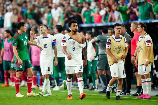 LAS&#x20;VEGAS,&#x20;NEVADA&#x20;-&#x20;JUNE&#x20;15&#x3A;&#x20;Weston&#x20;Mckennie&#x20;&#x23;8&#x20;of&#x20;USA&#x20;walks&#x20;with&#x20;a&#x20;torn&#x20;jersey&#x20;following&#x20;his&#x20;scuffle&#x20;during&#x20;the&#x20;second&#x20;half&#x20;against&#x20;Mexico&#x20;during&#x20;the&#x20;2023&#x20;CONCACAF&#x20;Nations&#x20;League&#x20;semifinals&#x20;at&#x20;Allegiant&#x20;Stadium&#x20;on&#x20;June&#x20;15,&#x20;2023&#x20;in&#x20;Las&#x20;Vegas,&#x20;Nevada.&#x20;&#x28;Photo&#x20;by&#x20;Louis&#x20;Grasse&#x2F;Getty&#x20;Images&#x29;