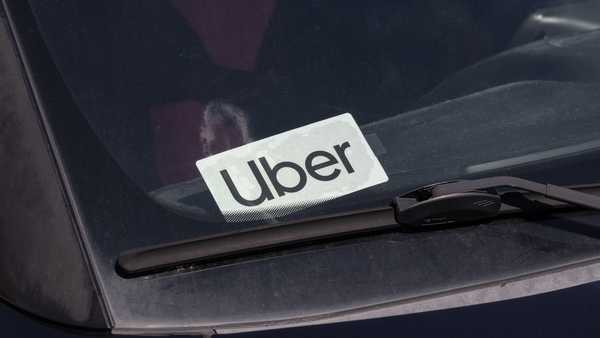 Muncie - July 10, 2023: Uber Car for hire sticker. Lyft and Uber have replaced many Taxi cabs for transportation with a smart phone app.