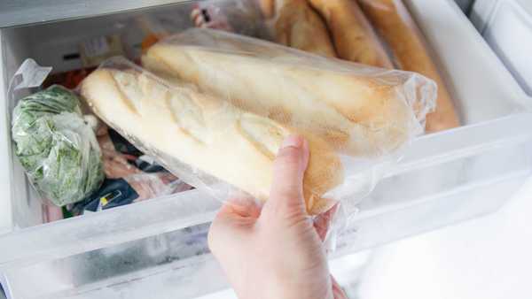 Putting in,  taking out baguettes from the freezer