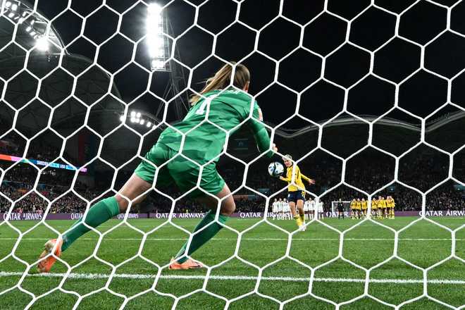 USA&apos;s goalkeeper #01 Alyssa Naeher (L) concedes the winning goal scored by Sweden&apos;s forward #08 Lina Hurtig (R) in the penalty shout-out during the Australia and New Zealand 2023 Women&apos;s World Cup round of 16 football match between Sweden and USA at Melbourne Rectangular Stadium in Melbourne on August 6, 2023. (Photo by WILLIAM WEST / AFP) (Photo by WILLIAM WEST/AFP via Getty Images)