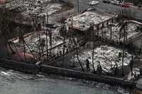 An aerial image taken on August 10, 2023 shows destroyed homes and buildings burned to the ground in Lahaina in the aftermath of wildfires in western Maui, Hawaii. At least 36 people have died after a fast-moving wildfire turned Lahaina to ashes, officials said August 9, 2023 as visitors asked to leave the island of Maui found themselves stranded at the airport. The fires began burning early August 8, scorching thousands of acres and putting homes, businesses and 35,000 lives at risk on Maui, the Hawaii Emergency Management Agency said in a statement. (Photo by Patrick T. Fallon / AFP) (Photo by PATRICK T. FALLON/AFP via Getty Images)