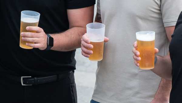 SYMBOL - 12 August 2023, Baden-Württemberg, Konstanz: Men hold mugs of beer in their hands at the Seenachtsfest. Photo: Silas Stein/dpa (Photo by Silas Stein/picture alliance via Getty Images)