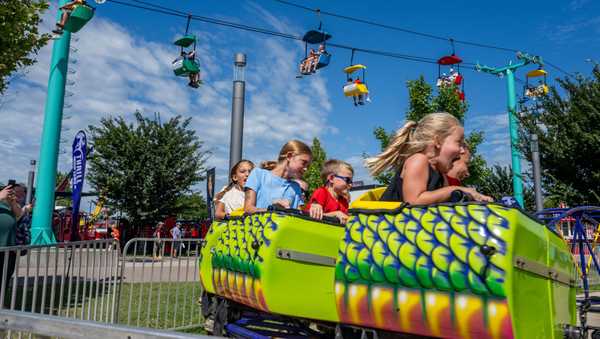 DES MOINES, IOWA - AUGUST 13: Children ride an attraction at the Iowa State Fair on August 13, 2023 in Des Moines, Iowa. Republican and Democratic presidential hopefuls, including Florida Gov. Ron DeSantis, former President Donald Trump visited the fair, a tradition in one of the first states to hold caucuses in 2024.  (Photo by Brandon Bell/Getty Images)
