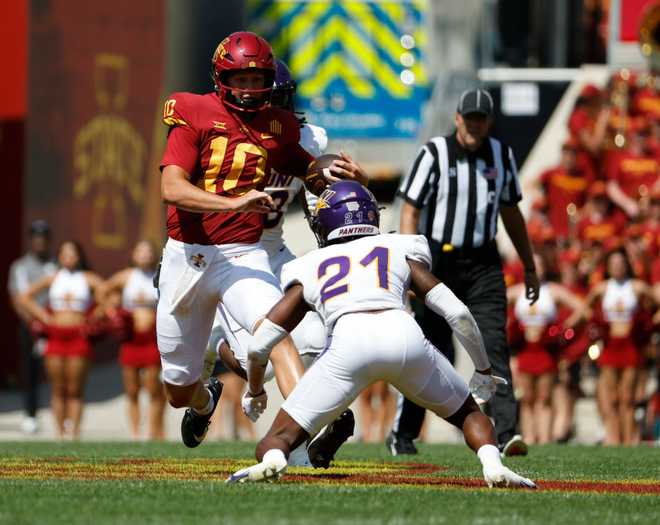 AMES,&#x20;IA&#x20;-&#x20;SEPTEMBER&#x20;2&#x3A;&#x20;Quarterback&#x20;J.J.&#x20;Kohl&#x20;&#x23;10&#x20;of&#x20;the&#x20;Iowa&#x20;State&#x20;Cyclones&#x20;scrambles&#x20;under&#x20;pressure&#x20;from&#x20;defensive&#x20;back&#x20;Edwin&#x20;Dearman&#x20;&#x23;21&#x20;of&#x20;the&#x20;Northern&#x20;Iowa&#x20;Panthers&#x20;in&#x20;the&#x20;first&#x20;half&#x20;of&#x20;play&#x20;at&#x20;Jack&#x20;Trice&#x20;Stadium&#x20;on&#x20;September&#x20;2,&#x20;2023&#x20;in&#x20;Ames,&#x20;Iowa.&#x20;&#x28;Photo&#x20;by&#x20;David&#x20;Purdy&#x2F;Getty&#x20;Images&#x29;