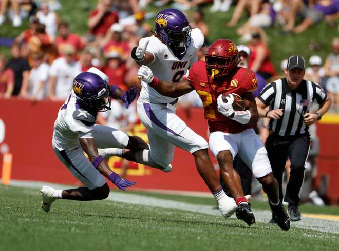 AMES,&#x20;IA&#x20;-&#x20;SEPTEMBER&#x20;2&#x3A;&#x20;Running&#x20;back&#x20;Abu&#x20;Sama&#x20;III&#x20;&#x23;24&#x20;of&#x20;the&#x20;Iowa&#x20;State&#x20;Cyclones&#x20;rushes&#x20;for&#x20;yards&#x20;while&#x20;defensive&#x20;back&#x20;Dalesean&#x20;Staley&#x20;&#x23;7,&#x20;and&#x20;defensive&#x20;lineman&#x20;Devin&#x20;Rice&#x20;&#x23;8&#x20;of&#x20;the&#x20;Northern&#x20;Iowa&#x20;Panthers&#x20;block&#x20;in&#x20;the&#x20;first&#x20;half&#x20;of&#x20;play&#x20;at&#x20;Jack&#x20;Trice&#x20;Stadium&#x20;on&#x20;September&#x20;2,&#x20;2023&#x20;in&#x20;Ames,&#x20;Iowa.&#x20;&#x28;Photo&#x20;by&#x20;David&#x20;Purdy&#x2F;Getty&#x20;Images&#x29;