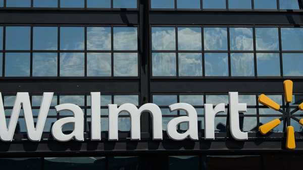 A Walmart logo is seen outside a store in Washington, DC, on August 18, 2020. - Walmart saw its profits jump in latest quarter as e-commerce sales surged during the coronavirus pandemic and US government stimulus payments boosted spending, the company reported on August 18. (Photo by NICHOLAS KAMM / AFP) (Photo by NICHOLAS KAMM/AFP via Getty Images)