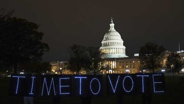 WASHINGTON, DC - NOVEMBER 14: On the eve of the negotiated deadline between House Democrats to vote on Build Back Better, MoveOn members came to the Capitol to tell Congress it's time to vote by holding handmade lighted signs at the US Capitol on November 14, 2021 in Washington, DC. (Photo by Jemal Countess/Getty Images for MoveOn)