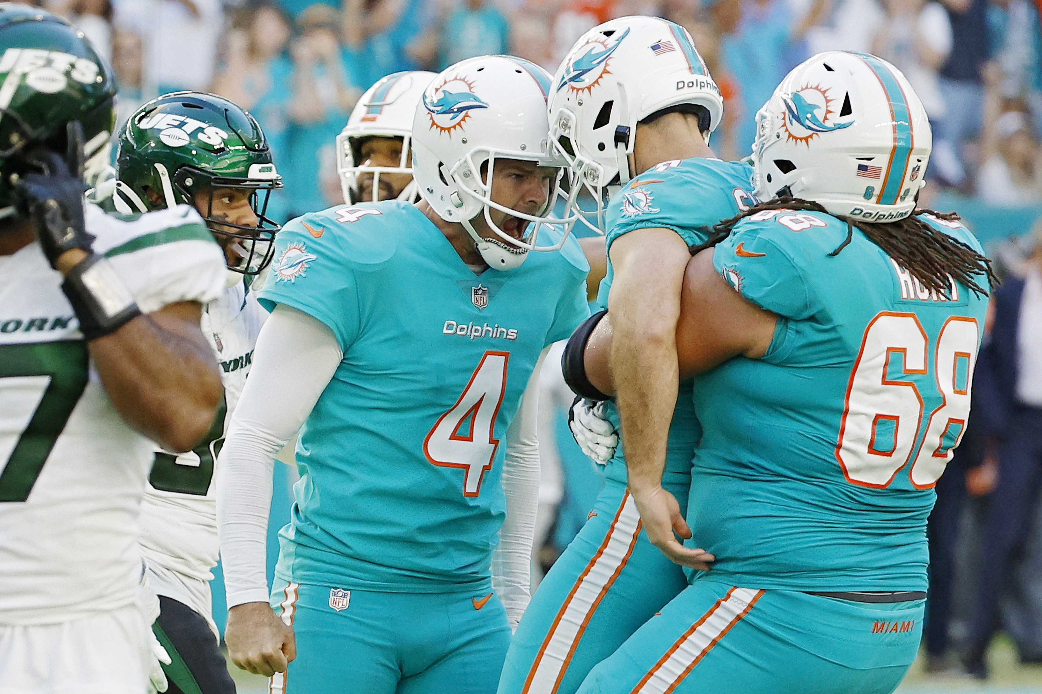 Dugger INT return helps lift Patriots over fading Dolphins 23-21