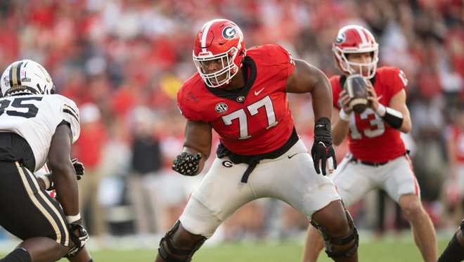 ATHENS, GA - OCTOBER 15: Devin Willock #77 of the  ;Georgia Bulldogs at the in action against the Vanderbilt Commodores at Sanford Stadium& #x20;on October 15, 2022 in Athens, Georgia. (Photo by Adam& #x20;Hagy/Getty Images)