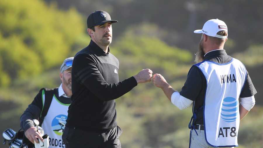 PEBBLE BEACH, CALIFORNIA - FEBRUARY 06:  Aaron Rodgers of the Green Bay Packers celebrates after chipping on to the second green during the during the first round of the AT&T Pebble Beach Pro-Am at Spyglass Hill Golf Course on February 06, 2020 in Pebble Beach, California. (Photo by Harry How/Getty Images)