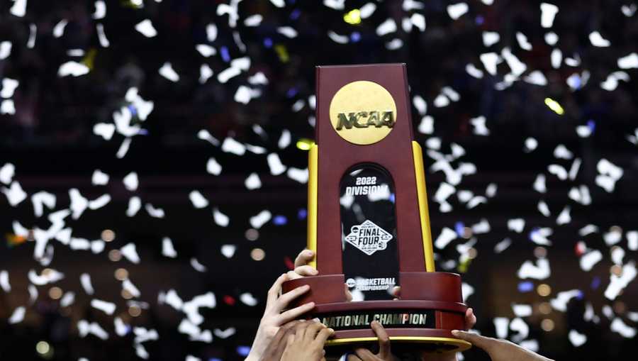 NEW ORLEANS, LOUISIANA - APRIL 04: The Kansas Jayhawks celebrate with the trophy after defeating the North Carolina Tar Heels 72-69 during the 2022 NCAA Men&apos;s Basketball Tournament National Championship at Caesars Superdome on April 04, 2022 in New Orleans, Louisiana. (Photo by Tom Pennington/Getty Images)