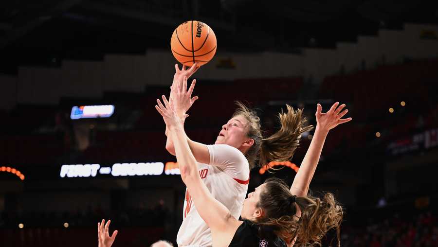 COLLEGE PARK, MD - MARCH 17: Abby Meyers #10 of the Maryland Terrapins shoots as Kaitlyn Flanagan #5 of the Holy Cross Crusaders defends during first half of the first round of the 2023 NCAA Women's Basketball Tournament held at the Xfinity Center on March 17, 2023 in College Park, Maryland. (Photo by Greg Fiume/NCAA Photos via Getty Images)