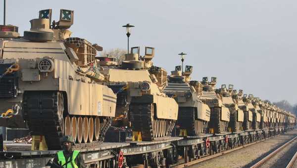 TOPSHOT - Abrams tanks are seen at the railway station near the Pabrade military base in Lithuania, on October 21, 2019. - The United States on October 21, 2019 began deploying a battalion of troops and dozens of tanks to Lithuania for an unprecedented six-month rotation, a move sought by the Baltic EU and NATO state to deter neighbouring Russia.  Dozens of Abrams tanks and Bradley armoured vehicles arrived by railway at the army training area in Pabrade.