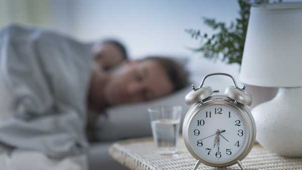 USA, New Jersey, Jersey City, Alarm clock in bedroom - stock photo