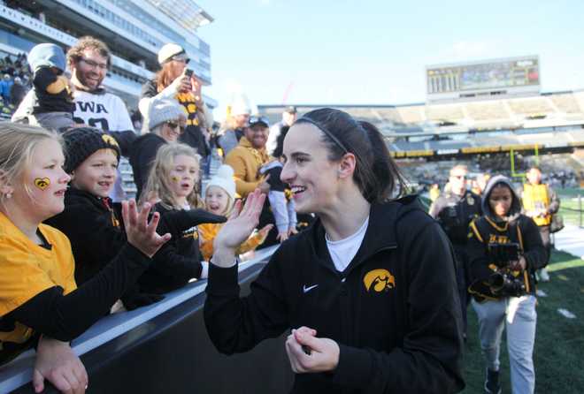 IOWA&#x20;CITY,&#x20;IOWA-&#x20;OCTOBER&#x20;15&#x3A;&#x20;&#x20;Guard&#x20;Caitlin&#x20;Clark&#x20;&#x23;22&#x20;of&#x20;the&#x20;Iowa&#x20;Hawkeyes&#x20;interacts&#x20;with&#x20;fans&#x20;after&#x20;the&#x20;match-up&#x20;against&#x20;the&#x20;DePaul&#x20;Blue&#x20;Demons&#x20;at&#x20;Kinnick&#x20;Stadium&#x20;during&#x20;the&#x20;Crossover&#x20;at&#x20;Kinnick&#x20;event&#x20;on&#x20;October&#x20;15,&#x20;2023&#x20;in&#x20;Iowa&#x20;City,&#x20;Iowa.&#x20;&#x20;&#x28;Photo&#x20;by&#x20;Matthew&#x20;Holst&#x2F;Getty&#x20;Images&#x29;
