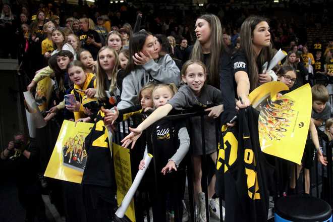 IOWA&#x20;CITY,&#x20;IOWA-&#x20;NOVEMBER&#x20;19&#x3A;&#x20;&#x20;Fans&#x20;wait&#x20;for&#x20;guard&#x20;Caitlin&#x20;Clark&#x20;&#x23;22&#x20;of&#x20;the&#x20;Iowa&#x20;Hawkeyes&#x20;after&#x20;the&#x20;match-up&#x20;against&#x20;the&#x20;Drake&#x20;Bulldogs&#x20;at&#x20;Carver-Hawkeye&#x20;Arena&#x20;on&#x20;November&#x20;19,&#x20;2023&#x20;in&#x20;Iowa&#x20;City,&#x20;Iowa.&#x20;&#x20;&#x28;Photo&#x20;by&#x20;Matthew&#x20;Holst&#x2F;Getty&#x20;Images&#x29;
