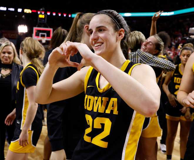 AMES,&#x20;IA&#x20;-&#x20;DECEMBER&#x20;6&#x3A;&#x20;Caitlin&#x20;Clark&#x20;&#x23;22&#x20;of&#x20;the&#x20;Iowa&#x20;Hawkeyes&#x20;reacts&#x20;making&#x20;a&#x20;heart&#x20;with&#x20;her&#x20;hands&#x20;after&#x20;the&#x20;Iowa&#x20;Hawkeyes&#x20;won&#x20;67-58&#x20;over&#x20;the&#x20;Iowa&#x20;State&#x20;Cyclones.&#x20;Clark&#x20;became&#x20;the&#x20;15th&#x20;player&#x20;in&#x20;Division&#x20;I&#x20;women&amp;apos&#x3B;s&#x20;basketball&#x20;history&#x20;to&#x20;reach&#x20;3,000&#x20;points&#x20;for&#x20;her&#x20;career&#x20;when&#x20;she&#x20;broke&#x20;3,000&#x20;points&#x20;with&#x20;a&#x20;three&#x20;point&#x20;basket&#x20;in&#x20;the&#x20;game&#x20;at&#x20;Hilton&#x20;Coliseum&#x20;on&#x20;December&#x20;6,&#x20;2023&#x20;in&#x20;Ames,&#x20;Iowa.&#x20;They&#x20;Iowa&#x20;Hawkeyes&#x20;won&#x20;67-58&#x20;over&#x20;the&#x20;Iowa&#x20;State&#x20;Cyclones.&#x20;&#x28;Photo&#x20;by&#x20;David&#x20;K&#x20;Purdy&#x2F;Getty&#x20;Images&#x29;