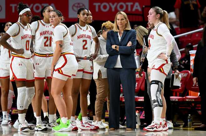 COLLEGE&#x20;PARK,&#x20;MARYLAND&#x20;-&#x20;NOVEMBER&#x20;19&#x3A;&#x20;Head&#x20;coach&#x20;Brenda&#x20;Frese&#x20;of&#x20;the&#x20;Maryland&#x20;Terrapins&#x20;talks&#x20;to&#x20;her&#x20;team&#x20;during&#x20;the&#x20;game&#x20;against&#x20;the&#x20;Syracuse&#x20;Orange&#x20;at&#x20;Xfinity&#x20;Center&#x20;on&#x20;November&#x20;19,&#x20;2023&#x20;in&#x20;College&#x20;Park,&#x20;Maryland.&#x20;&#x28;Photo&#x20;by&#x20;G&#x20;Fiume&#x2F;Getty&#x20;Images&#x29;