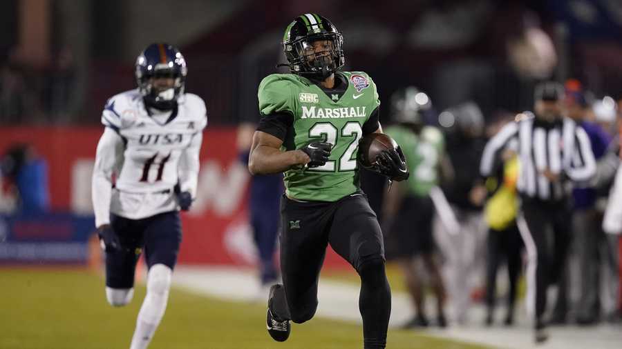 FRISCO, TEXAS - DECEMBER 19: Rasheen Ali #22 of the Marshall Thundering Herd runs with the ball during the first half of the Frisco Bowl against the UTSA Roadrunners at Toyota Stadium on December 19, 2023 in Frisco, Texas. (Photo by Sam Hodde/Getty Images)