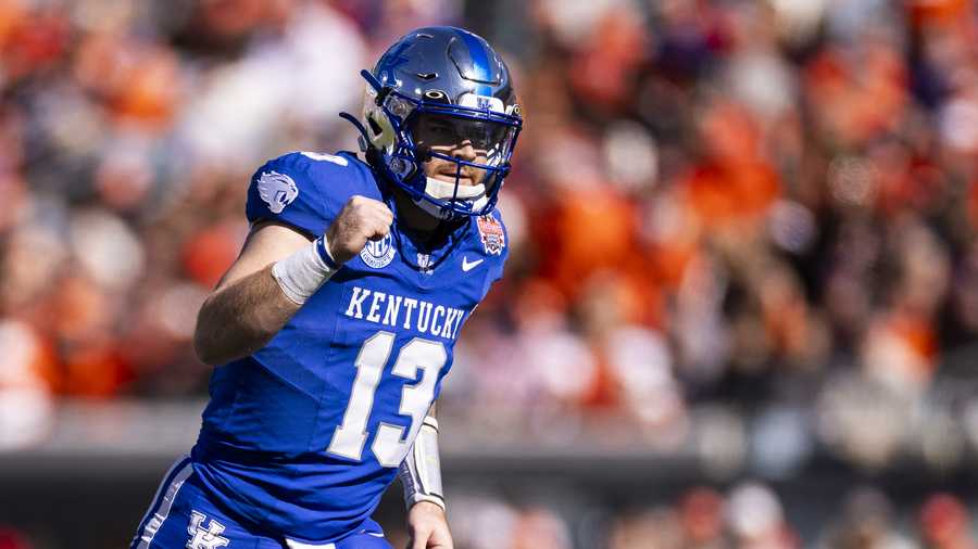 JACKSONVILLE, FLORIDA - DECEMBER 29: Devin Leary #13 of the Kentucky Wildcats celebrates a touchdown during the first half of the TaxSlayer Gator Bowl against the Clemson Tigers at EverBank Stadium on December 29, 2023 in Jacksonville, Florida. (Photo by James Gilbert/Getty Images)