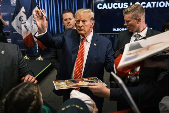 NEWTON,&#x20;IOWA&#x20;-&#x20;January&#x20;6&#x3A;&#x20;Former&#x20;president&#x20;Donald&#x20;Trump&#x20;signs&#x20;autographs&#x20;at&#x20;a&#x20;campaign&#x20;rally&#x20;at&#x20;Des&#x20;Moines&#x20;Area&#x20;Community&#x20;College&#x20;in&#x20;Newton,&#x20;Iowa&#x20;on&#x20;Saturday,&#x20;January&#x20;6,&#x20;2024.&#x20;&#x0A;&#x0A;&#x28;Photo&#x20;by&#x20;Jordan&#x20;Gale&#x2F;For&#x20;The&#x20;Washington&#x20;Post&#x20;via&#x20;Getty&#x20;Images&#x29;