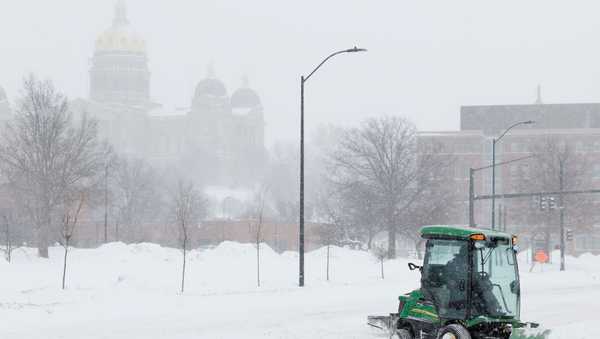 DES MOINES, IOWA - JANUARY 12: A snow plow clears snow from a road near the Iowa State Capitol on January 12, 2024 in Des Moines, Iowa. The second winter weather system in a week is bringing blizzard conditions across Iowa as voters prepare for the Republican Party of Iowa's presidential caucuses on January 15th. (Photo by Anna Moneymaker/Getty Images)