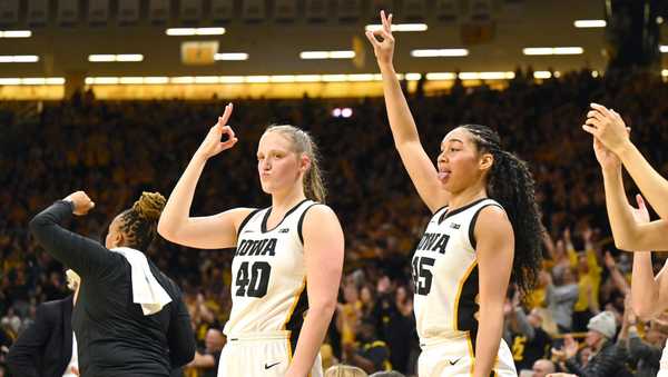 IOWA CITY, IA - JANUARY 13: Iowa center Sharon Goodman (40) and Iowa forward Hannah Stuelke (45) react to a teammate's three-point shot during a college women's basketball game between the Indiana Hoosiers and the Iowa Hawkeyes on January 13, 2024, at Carver-Hawkeye Arena in Iowa City, IA. (Photo by Keith Gillett/Icon Sportswire via Getty Images)