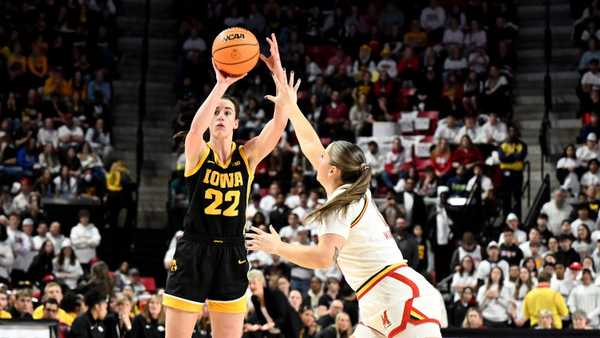 COLLEGE PARK, MARYLAND - FEBRUARY 03: Caitlin Clark #22 of the Iowa Hawkeyes shoots the ball against Faith Masonius #13 of the Maryland Terrapins at Xfinity Center on February 03, 2024 in College Park, Maryland. (Photo by G Fiume/Getty Images)