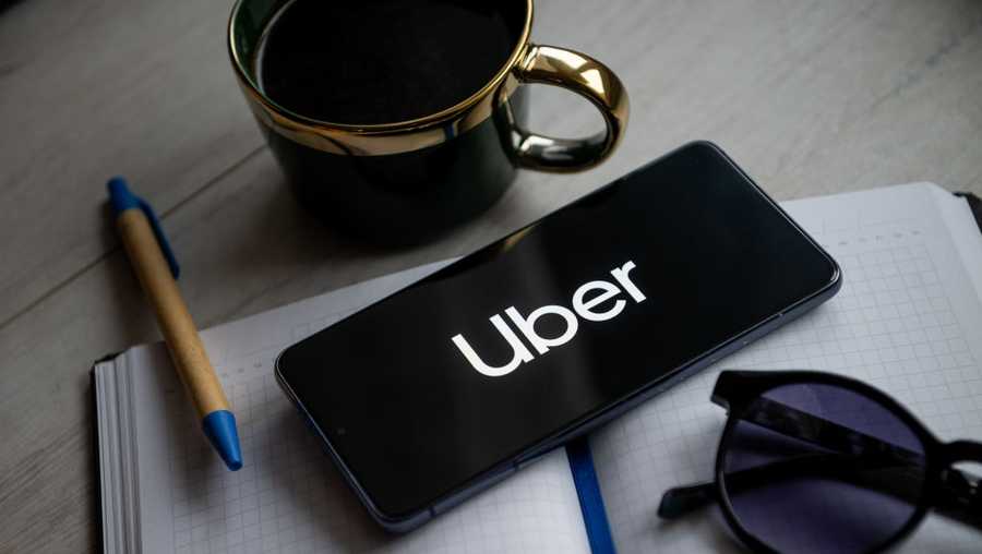 POLAND - 2024/01/31: In this photo illustration a Uber logo seen displayed on a smartphone. (Photo Illustration by Mateusz Slodkowski/SOPA Images/LightRocket via Getty Images)
