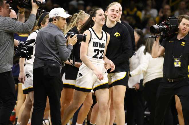 IOWA&#x20;CITY,&#x20;IOWA-&#x20;FEBRUARY&#x20;15&#x3A;&#x20;&#x20;Guard&#x20;Caitlin&#x20;Clark&#x20;&#x23;22&#x20;of&#x20;the&#x20;Iowa&#x20;Hawkeyes&#x20;is&#x20;surrounded&#x20;by&#x20;teammates&#x20;after&#x20;breaking&#x20;the&#x20;NCAA&#x20;women&amp;apos&#x3B;s&#x20;all-time&#x20;scoring&#x20;record,&#x20;surpassing&#x20;the&#x20;previous&#x20;mark&#x20;of&#x20;3,527&#x20;points&#x20;during&#x20;the&#x20;first&#x20;half&#x20;against&#x20;the&#x20;Michigan&#x20;Wolverines&#x20;&#x20;at&#x20;Carver-Hawkeye&#x20;Arena&#x20;on&#x20;February&#x20;15,&#x20;2024&#x20;in&#x20;Iowa&#x20;City,&#x20;Iowa.&#x20;&#x20;&#x28;Photo&#x20;by&#x20;Matthew&#x20;Holst&#x2F;Getty&#x20;Images&#x29;