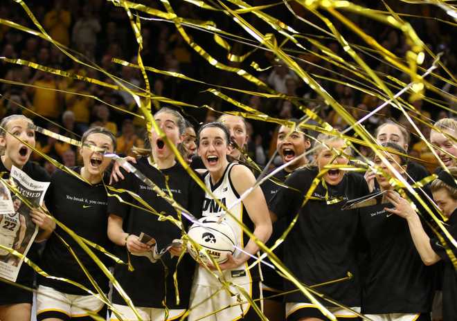 IOWA&#x20;CITY,&#x20;IOWA-&#x20;FEBRUARY&#x20;15&#x3A;&#x20;&#x20;Guard&#x20;Caitlin&#x20;Clark&#x20;&#x23;22&#x20;of&#x20;the&#x20;Iowa&#x20;Hawkeyes&#x20;celebrates&#x20;with&#x20;teammates&#x20;during&#x20;a&#x20;presentation&#x20;after&#x20;breaking&#x20;the&#x20;NCAA&#x20;women&amp;apos&#x3B;s&#x20;all-time&#x20;scoring&#x20;record&#x20;during&#x20;the&#x20;game&#x20;against&#x20;the&#x20;Michigan&#x20;Wolverines&#x20;&#x20;at&#x20;Carver-Hawkeye&#x20;Arena&#x20;on&#x20;February&#x20;15,&#x20;2024&#x20;in&#x20;Iowa&#x20;City,&#x20;Iowa.&#x20;&#x20;&#x28;Photo&#x20;by&#x20;Matthew&#x20;Holst&#x2F;Getty&#x20;Images&#x29;