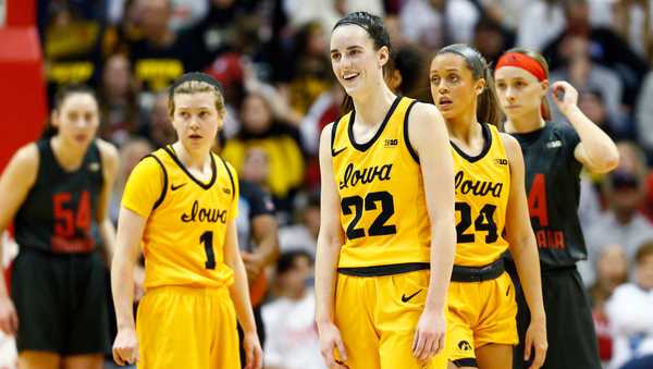 BLOOMINGTON, IN - FEBRUARY 22: Iowa Hawkeyes guard Caitlin Clark (22) smiles at the referee during a women's college basketball game between the Iowa Hawkeyes and the Indiana Hoosiers on February 22, 2024 at Simon Skjodt Assembly Hall in Bloomington, IN.  (Photo by Jeffrey Brown/Icon Sportswire via Getty Images)