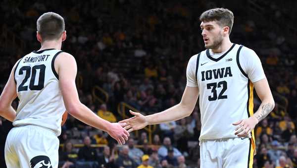 IOWA CITY, IA - FEBRUARY 27: Iowa forward Payton Sandfort (20) thanks Iowa forward Owen Freeman (32) for his blocked shot during a college basketball game between the Penn State Nittany Lions and the Iowa Hawkeyes on February 27, 2024, at Carver-Hawkeye Arena in Iowa City, IA. (Photo by Keith Gillett/Icon Sportswire via Getty Images)
