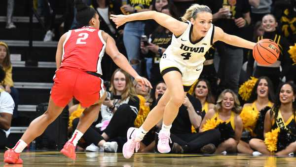 IOWA CITY, IA - MARCH 03: Iowa guard Kylie Feurbach(4) goes after a loose ball as Ohio State guard Jack Sheldon (4) defends during a women's college basketball game between the Ohio State Buckeyes and the Iowa Hawkeyes on March 03, 2024, at Carver-Hawkeye Arena in Iowa City, IA. (Photo by Keith Gillett/Icon Sportswire via Getty Images)