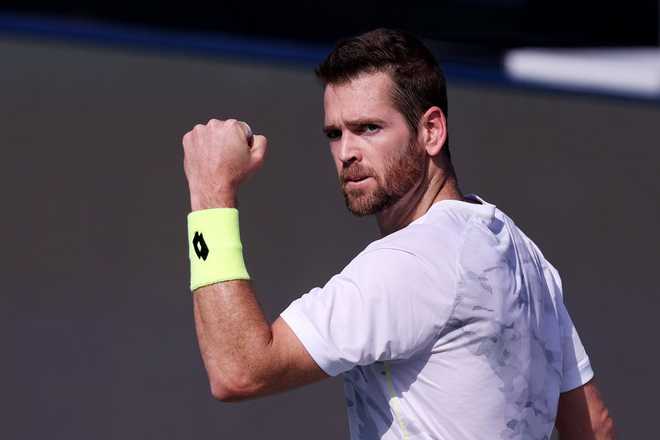 DUBAI, UNITED ARAB EMIRATES - MARCH 01: Austin Krajicek of the United States celebrates victory with partner Ivan Dodig of Croatia over Yuki Bhambri of India and Robin Haase of the Netherlands in their men&amp;apos;s doubles semifinal match during the Dubai Duty Free Tennis Championships at Dubai Duty Free Tennis Stadium on March 01, 2024 in Dubai, United Arab Emirates. (Photo by Christopher Pike/Getty Images)