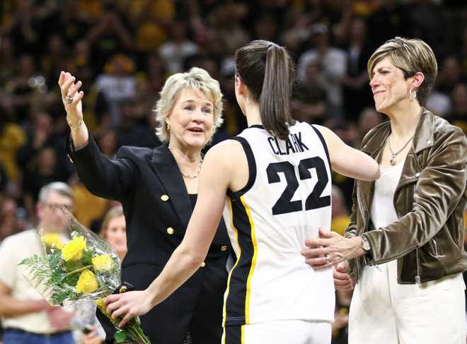 IOWA&#x20;CITY,&#x20;IOWA-&#x20;MARCH&#x20;3&#x3A;&#x20;Head&#x20;coach&#x20;Lisa&#x20;Bluder&#x20;&#x28;L&#x29;&#x20;and&#x20;associate&#x20;head&#x20;coach&#x20;Jan&#x20;Jensen&#x20;&#x28;R&#x29;&#x20;of&#x20;the&#x20;Iowa&#x20;Hawkeyes&#x20;hug&#x20;guard&#x20;Caitlin&#x20;Clark&#x20;&#x23;22&#x20;during&#x20;the&#x20;senior&#x20;day&#x20;program&#x20;following&#x20;the&#x20;match-up&#x20;against&#x20;the&#x20;Ohio&#x20;State&#x20;Buckeyes&#x20;at&#x20;Carver-Hawkeye&#x20;Arena&#x20;on&#x20;March&#x20;3,&#x20;2024&#x20;in&#x20;Iowa&#x20;City,&#x20;Iowa.&#x20;&#x28;Photo&#x20;by&#x20;Matthew&#x20;Holst&#x2F;Getty&#x20;Images&#x29;