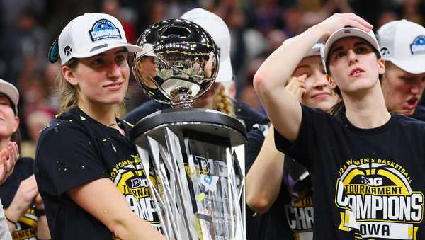 MINNEAPOLIS, MINNESOTA - MARCH 10: Kate Martin #20 of the Iowa Hawkeyes holds the trophy after defeating the Nebraska Cornhuskers 94-89 in overtime to win the Big Ten Women's Basketball Tournament Championship at Target Center on March 10, 2024 in Minneapolis, Minnesota. (Photo by Adam Bettcher/Getty Images)