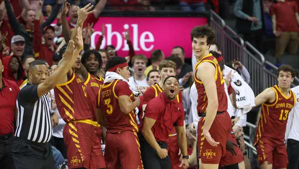 KANSAS CITY, MO - MARCH 16: Iowa State Cyclones forward Milan Momcilovic (22) smiles and the bench goes wild after he hit a three in the second half of the Big 12 tournament final between the Iowa State Cyclones and Houston Cougars on Mar 16, 2024 at T-Mobile Center in Kansas City, MO. (Photo by Scott Winters/Icon Sportswire via Getty Images)