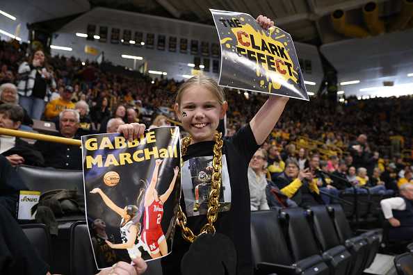 IOWA&#x20;CITY,&#x20;IOWA&#x20;-&#x20;MARCH&#x20;23&#x3A;&#x20;Teagan&#x20;Vanhooreweghe,&#x20;9,&#x20;of&#x20;Waterloo,&#x20;Iowa,&#x20;holds&#x20;signs&#x20;in&#x20;support&#x20;of&#x20;the&#x20;Iowa&#x20;Hawkeyes&#x20;prior&#x20;to&#x20;tipoff&#x20;against&#x20;the&#x20;Holy&#x20;Cross&#x20;Crusaders&#x20;during&#x20;the&#x20;first&#x20;round&#x20;of&#x20;the&#x20;2024&#x20;NCAA&#x20;Women&amp;apos&#x3B;s&#x20;Basketball&#x20;Tournament&#x20;held&#x20;at&#x20;Carver-Hawkeye&#x20;Arena&#x20;on&#x20;March&#x20;23,&#x20;2024&#x20;in&#x20;Iowa&#x20;City,&#x20;Iowa.&#x20;&#x28;Photo&#x20;by&#x20;Rebecca&#x20;Gratz&#x2F;NCAA&#x20;Photos&#x20;via&#x20;Getty&#x20;Images&#x29;