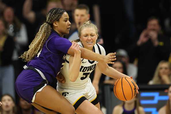 IOWA&#x20;CITY,&#x20;IOWA&#x20;-&#x20;MARCH&#x20;23&#x3A;&#x20;Sydney&#x20;Affolter&#x20;&#x23;3&#x20;of&#x20;the&#x20;Iowa&#x20;Hawkeyes,&#x20;right,&#x20;dribbles&#x20;around&#x20;the&#x20;defense&#x20;of&#x20;Simone&#x20;Foreman&#x20;&#x23;24&#x20;of&#x20;the&#x20;Holy&#x20;Cross&#x20;Crusaders&#x20;during&#x20;the&#x20;first&#x20;round&#x20;of&#x20;the&#x20;2024&#x20;NCAA&#x20;Women&amp;apos&#x3B;s&#x20;Basketball&#x20;Tournament&#x20;held&#x20;at&#x20;Carver-Hawkeye&#x20;Arena&#x20;on&#x20;March&#x20;23,&#x20;2024&#x20;in&#x20;Iowa&#x20;City,&#x20;Iowa.&#x20;&#x28;Photo&#x20;by&#x20;Rebecca&#x20;Gratz&#x2F;NCAA&#x20;Photos&#x20;via&#x20;Getty&#x20;Images&#x29;