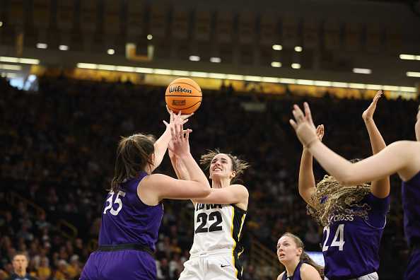 IOWA&#x20;CITY,&#x20;IOWA&#x20;-&#x20;MARCH&#x20;23&#x3A;&#x20;Caitlin&#x20;Clark&#x20;&#x23;22&#x20;of&#x20;the&#x20;Iowa&#x20;Hawkeyes&#x20;shoots&#x20;the&#x20;ball&#x20;over&#x20;Lindsay&#x20;Berger&#x20;&#x23;35&#x20;of&#x20;the&#x20;Holy&#x20;Cross&#x20;Crusaders&#x20;during&#x20;the&#x20;first&#x20;round&#x20;of&#x20;the&#x20;2024&#x20;NCAA&#x20;Women&amp;apos&#x3B;s&#x20;Basketball&#x20;Tournament&#x20;held&#x20;at&#x20;Carver-Hawkeye&#x20;Arena&#x20;on&#x20;March&#x20;23,&#x20;2024&#x20;in&#x20;Iowa&#x20;City,&#x20;Iowa.&#x20;&#x28;Photo&#x20;by&#x20;Rebecca&#x20;Gratz&#x2F;NCAA&#x20;Photos&#x20;via&#x20;Getty&#x20;Images&#x29;