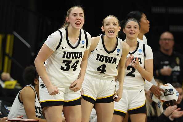 IOWA&#x20;CITY,&#x20;IOWA&#x20;-&#x20;MARCH&#x20;23&#x3A;&#x20;AJ&#x20;Ediger&#x20;&#x23;34&#x20;of&#x20;the&#x20;Iowa&#x20;Hawkeyes&#x20;stands&#x20;with&#x20;teammates&#x20;Kylie&#x20;Feuerbach&#x20;&#x23;4&#x20;and&#x20;Taylor&#x20;McCabe&#x20;&#x23;2&#x20;as&#x20;the&#x20;Hawkeyes&#x20;play&#x20;the&#x20;Holy&#x20;Cross&#x20;Crusaders&#x20;during&#x20;the&#x20;first&#x20;round&#x20;of&#x20;the&#x20;2024&#x20;NCAA&#x20;Women&amp;apos&#x3B;s&#x20;Basketball&#x20;Tournament&#x20;held&#x20;at&#x20;Carver-Hawkeye&#x20;Arena&#x20;on&#x20;March&#x20;23,&#x20;2024&#x20;in&#x20;Iowa&#x20;City,&#x20;Iowa.&#x20;&#x28;Photo&#x20;by&#x20;Rebecca&#x20;Gratz&#x2F;NCAA&#x20;Photos&#x20;via&#x20;Getty&#x20;Images&#x29;