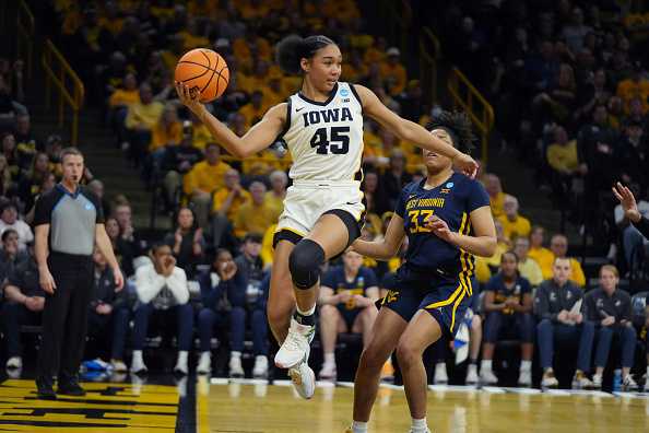 IOWA&#x20;CITY,&#x20;IOWA&#x20;-&#x20;MARCH&#x20;25&#x3A;&#x20;Hannah&#x20;Stuelke&#x20;&#x23;45&#x20;of&#x20;the&#x20;Iowa&#x20;Hawkeyes&#x20;saves&#x20;the&#x20;ball&#x20;from&#x20;going&#x20;out&#x20;of&#x20;bounds&#x20;against&#x20;the&#x20;West&#x20;Virginia&#x20;Mountaineers&#x20;during&#x20;the&#x20;second&#x20;round&#x20;of&#x20;the&#x20;2024&#x20;NCAA&#x20;Women&amp;apos&#x3B;s&#x20;Basketball&#x20;Tournament&#x20;held&#x20;at&#x20;Carver-Hawkeye&#x20;Arena&#x20;on&#x20;March&#x20;25,&#x20;2024&#x20;in&#x20;Iowa&#x20;City,&#x20;Iowa.&#x20;&#x28;Photo&#x20;by&#x20;Bryon&#x20;Houlgrave&#x2F;NCAA&#x20;Photos&#x20;via&#x20;Getty&#x20;Images&#x29;